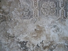 embossed wallpaper with textured plaster wall